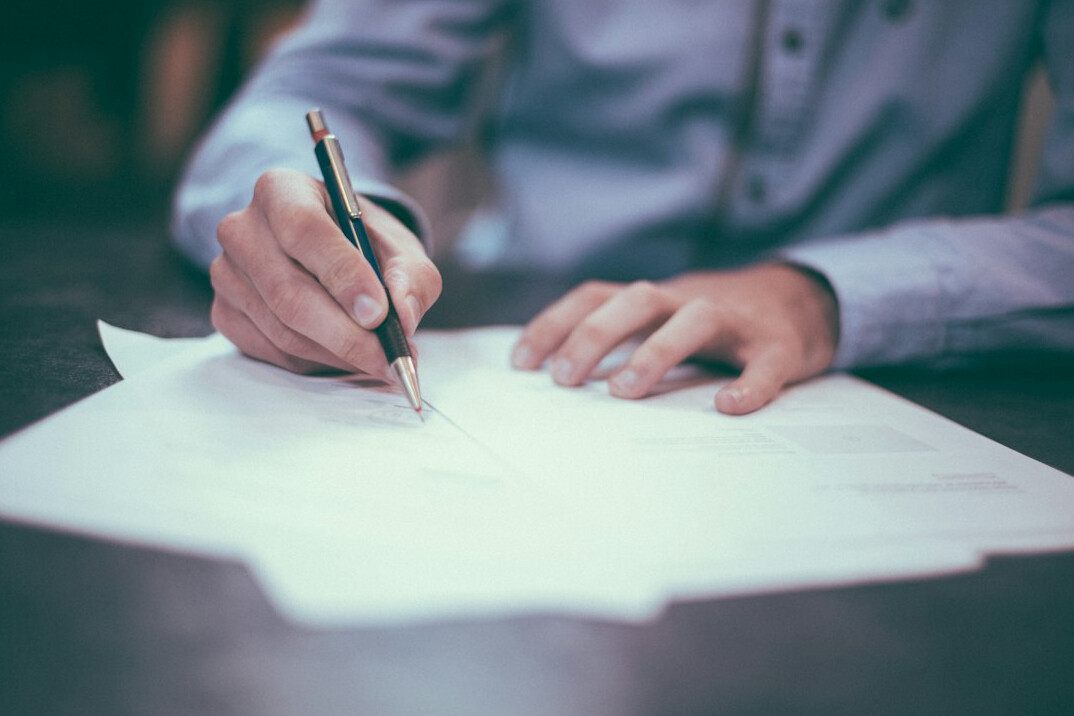 person setting goals on paper